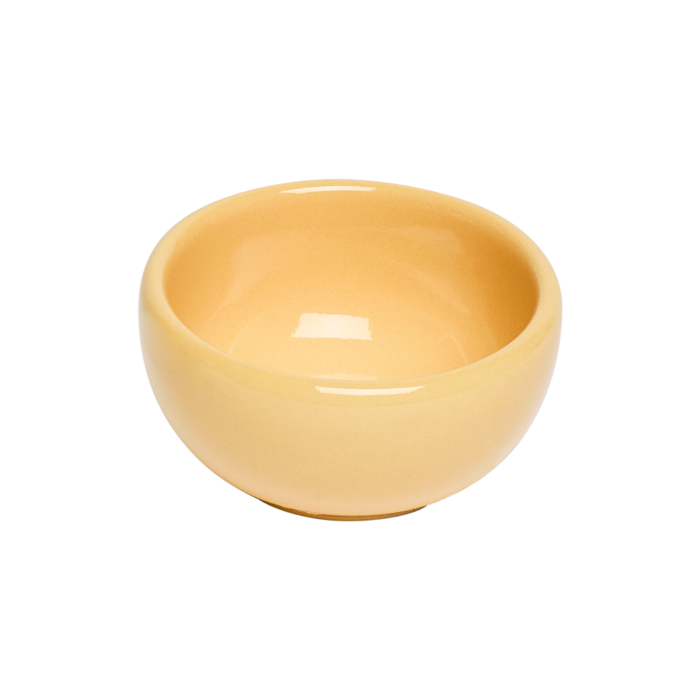 Yellow ceramic bowl on a white background