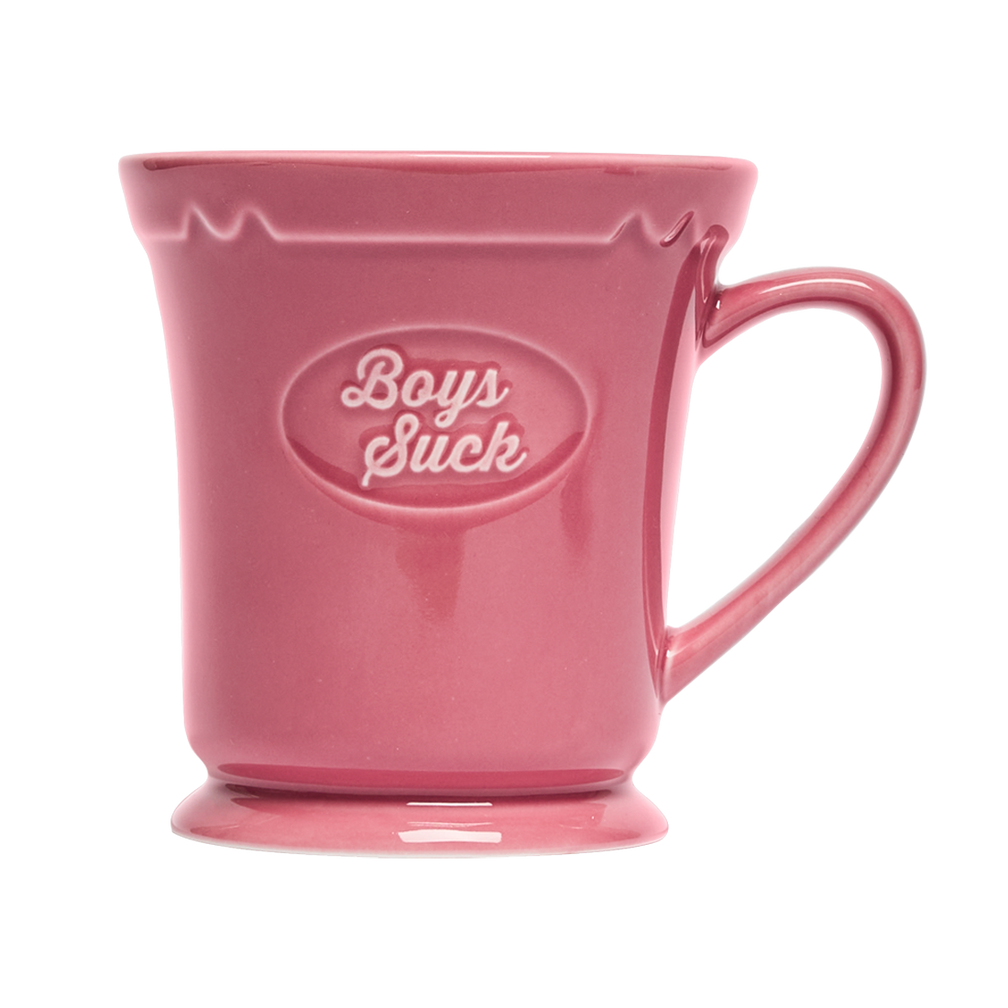 Pink mug with 'Boys Suck' text on a white background