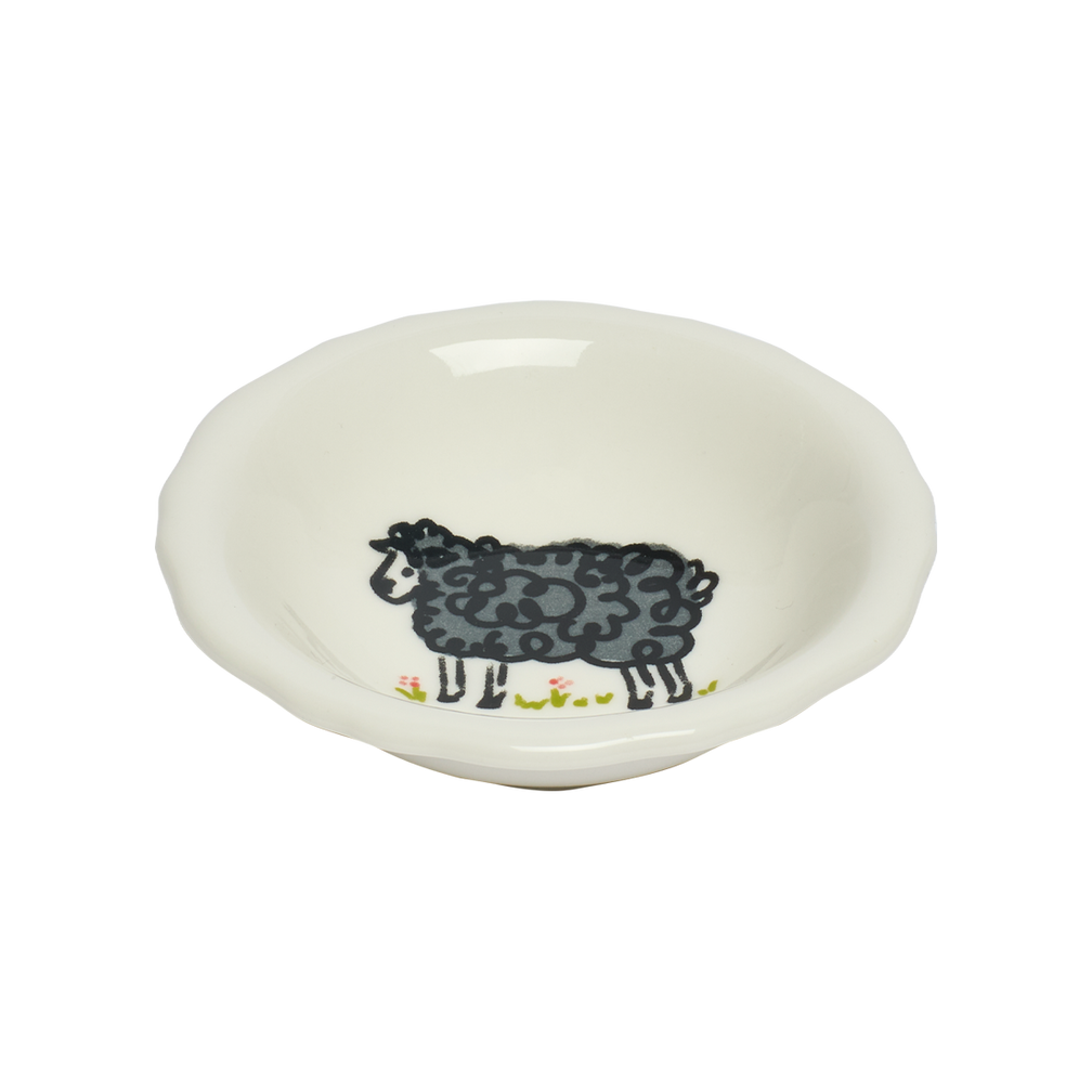 White ceramic bowl with a black sheep design on a white background