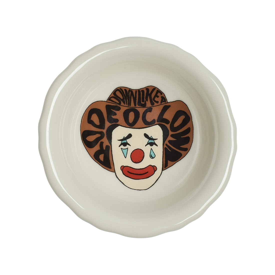 Ceramic bowl with clown face design on a white background