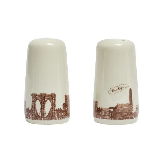 Two ceramic salt and pepper shakers with Brooklyn Bridge design on a white background