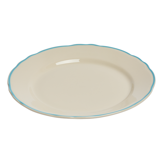 Beige ceramic plate with a blue rim on a white background