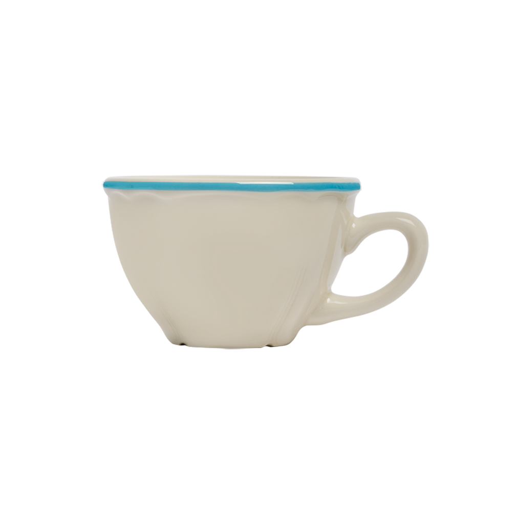 White ceramic cup with a blue rim on a white background