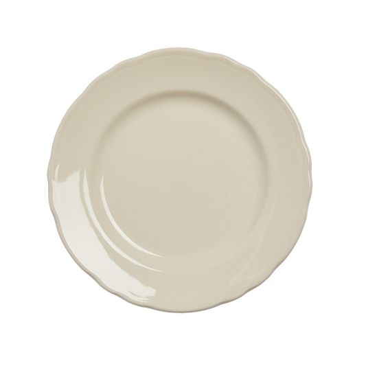 Beige ceramic plate on a white background