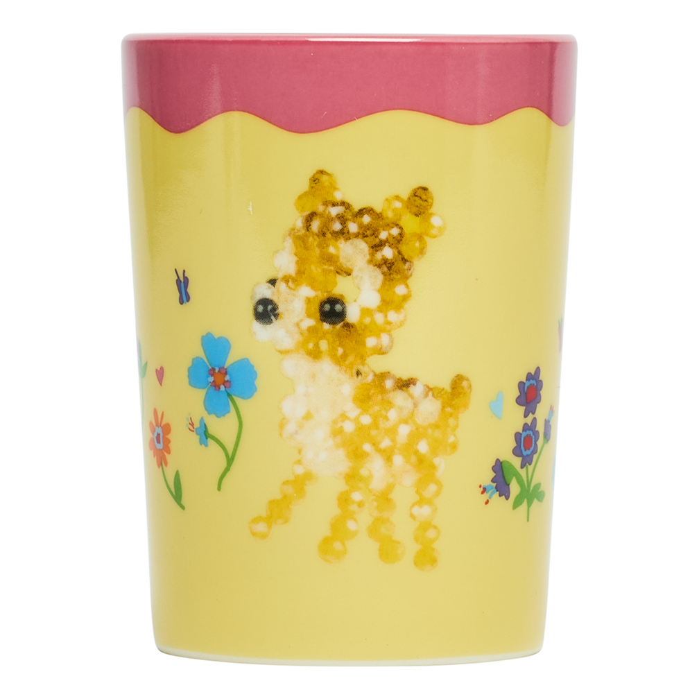 Decorative tumbler with a deer and floral design on a yellow background