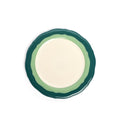 Scalloped cream salad plate from above with a two-tone teal and seagreen rim