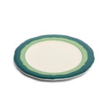 Scalloped salad plate with two-tone teal and seagreen rim, angled to show the wavy edge
