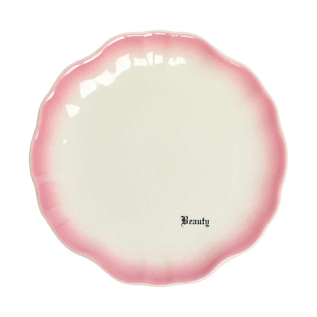 Pink and white ceramic dish with 'Beauty' text on a white background