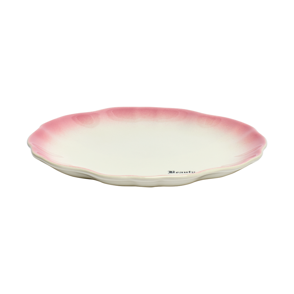 Ceramic plate with pink rim on a white background