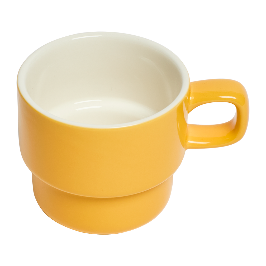 Yellow ceramic mug with a white interior on a white background