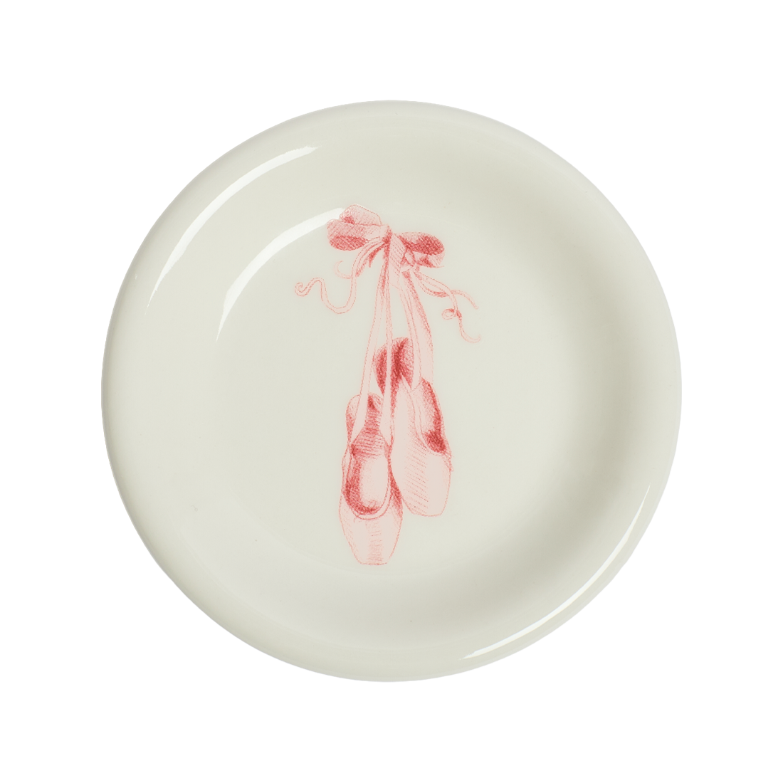 Round ceramic plate with pink ballet slipper design on a white background