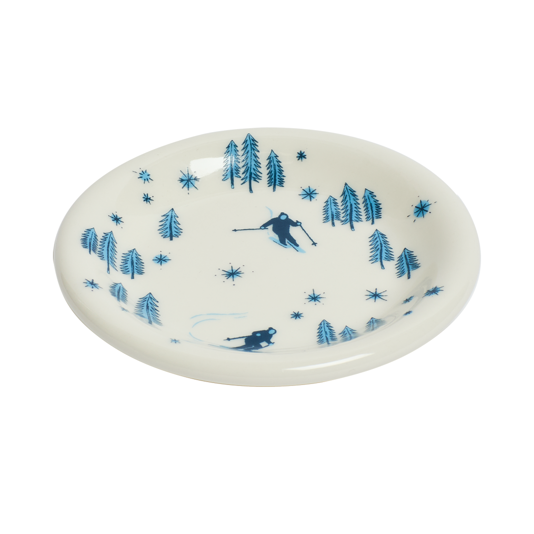 White plate with blue skiing and forest design on a white background
