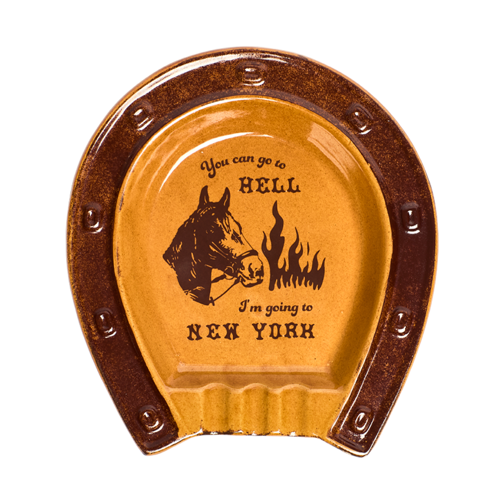 Horseshoe-shaped ceramic coaster with humorous text and horse illustration on a white background