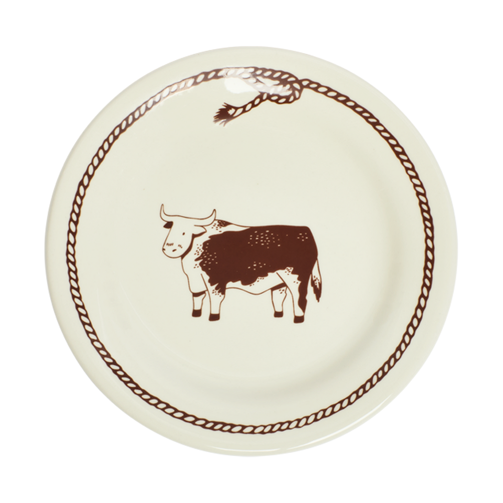 Round plate with a brown cow illustration on a white background