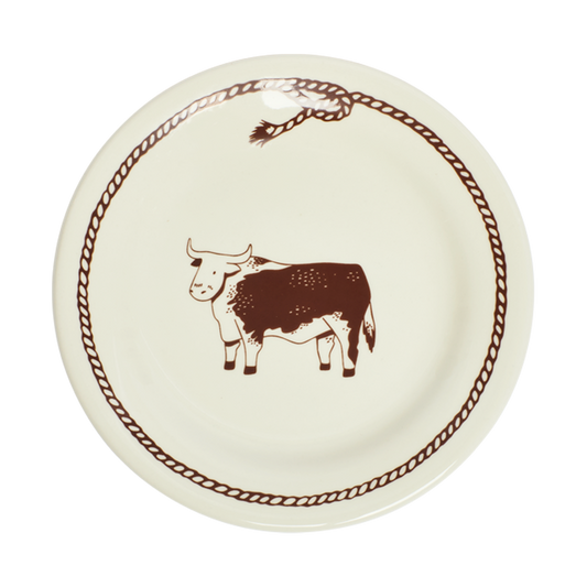 Round plate with a brown cow illustration on a white background