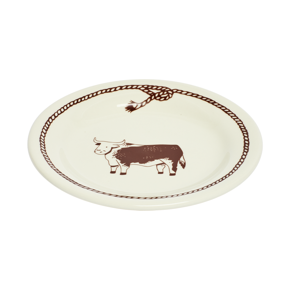 Round ceramic plate with a bull design and decorative border on a white background