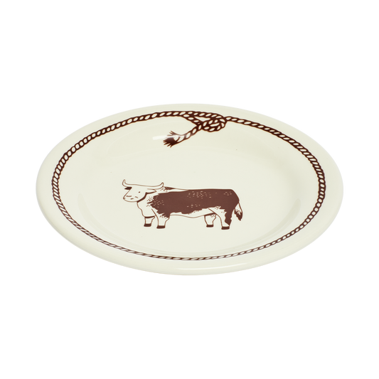 Round ceramic plate with a bull design and decorative border on a white background