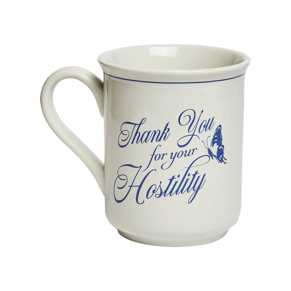 Novelty white ceramic mug with “Thank You for Your Hostility” printed in blue calligraphy and accented by a butterfly graphic. Humorous gift mug for coffee, tea, and passive-aggressive mornings. Angled view.