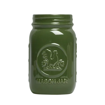 Front view of a green ceramic mason jar tumbler with embossed jar-style detailing, useful for drinks, utensils, flowers, or countertop storage.