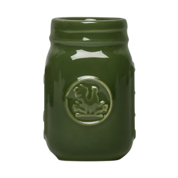 Front view of a tiny green ceramic mason jar with classic jar detailing, ideal for small sips, condiments, toothpicks, or tiny kitchen essentials.