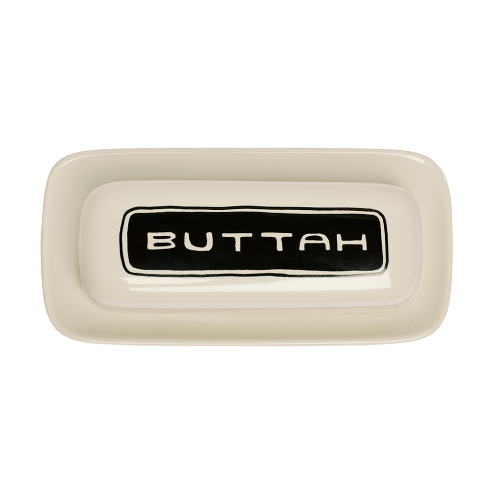 Rectangular ceramic butter dish with 'BUTTAH' label on a white background