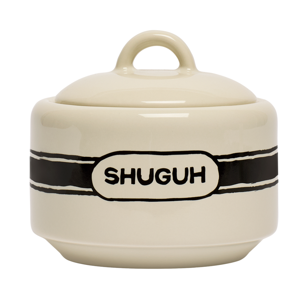 Cream-colored ceramic container with a black band and 'SHUGUH' branding on a white background