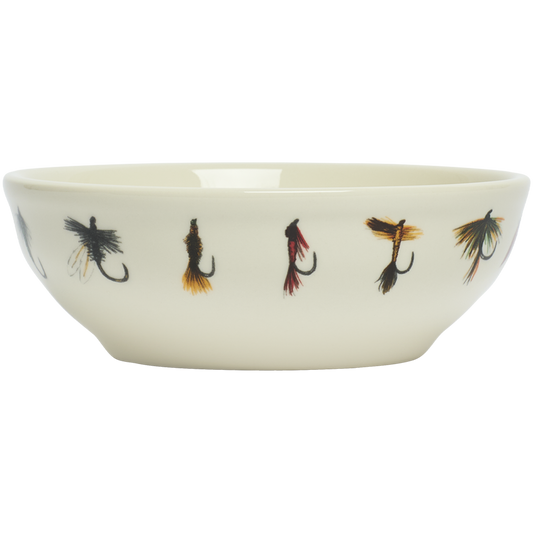 Ceramic bowl with fishing fly designs on a white background