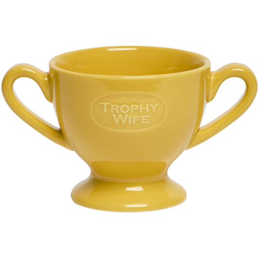 Yellow mug with 'Trophy Wife' text on a white background