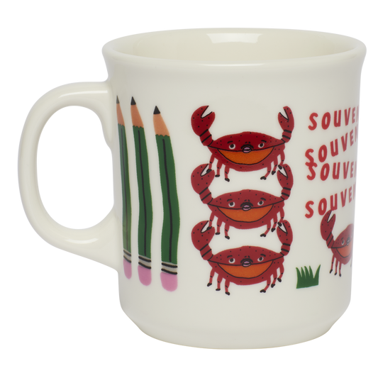 White mug with crab and pencil design on a white background