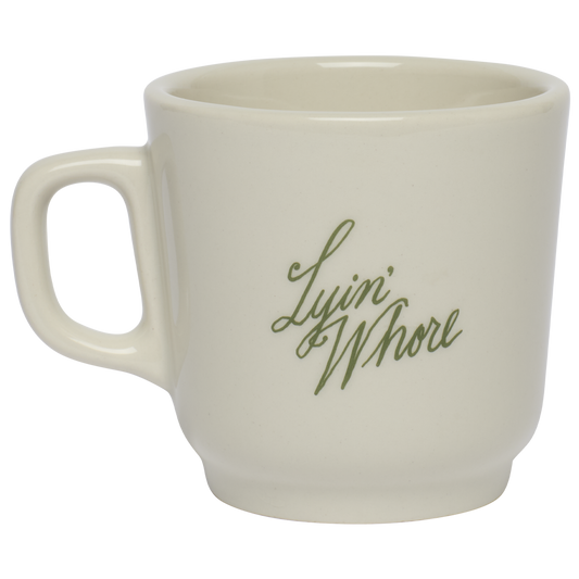 White mug with green text on a white background