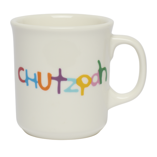 White mug with 'CHUTZPAH' in colorful letters on a white background