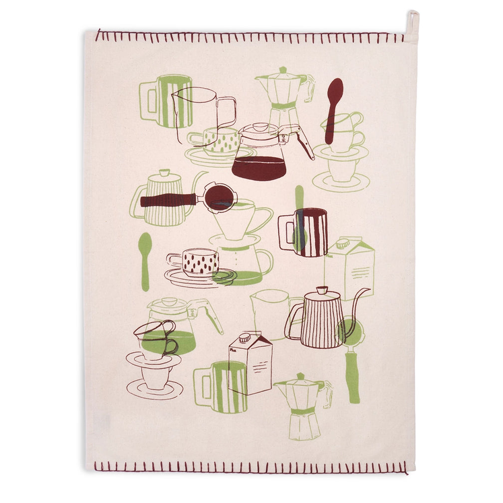 Natural cream coffee tea towel laid flat vertically, showing an allover green and burgundy illustration of moka pots, pour-over brewers, carafes, mugs, cups, and spoons, with stitched top and bottom borders.