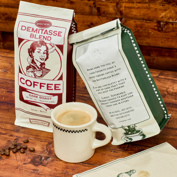 Coffee package, mug, and beans on a wooden surface with a rustic background